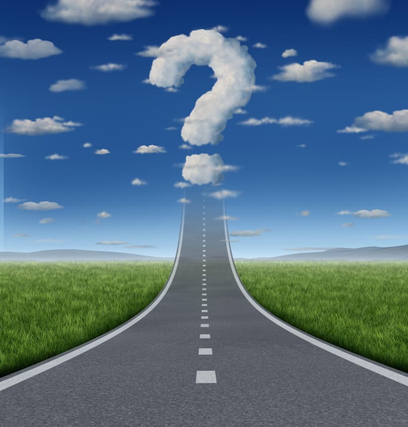 Road leading to question mark in clouds