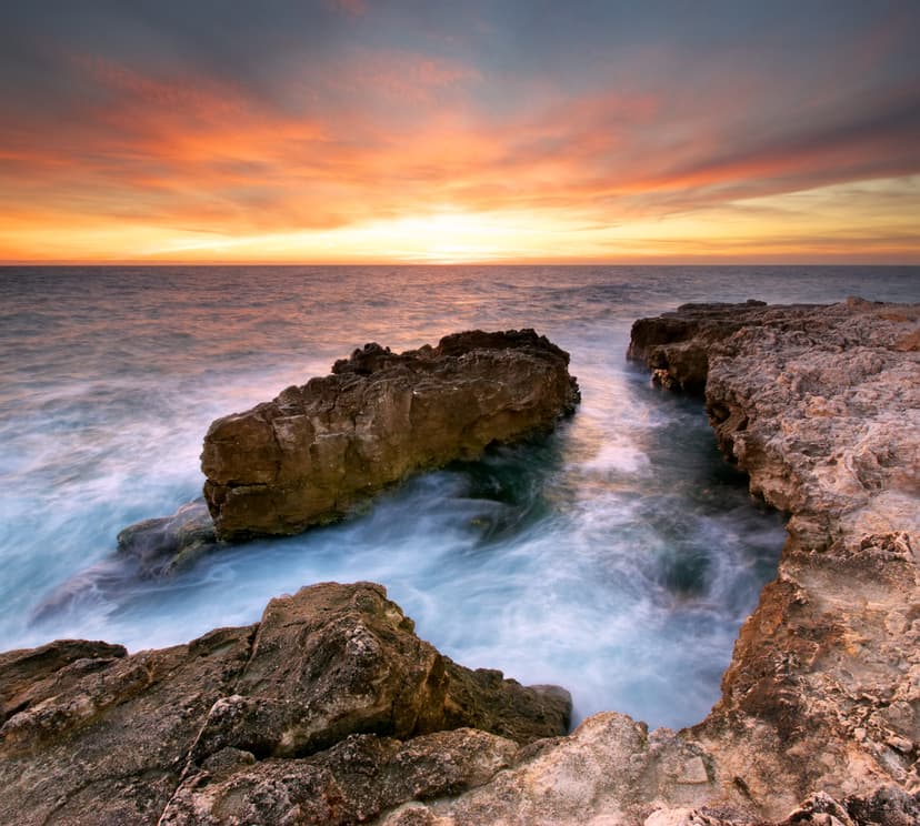 Beautiful seascape. Sea and rock at the sunset. Nature compositi
